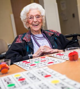 senior enjoys social activities at InnovAge PACE center